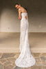 A woman wearing a strapless white lace wedding gown with a long train_XS_
