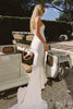 A woman wearing a strapless white mermaid style gown_XS_