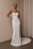 A woman wearing a strapless white mermaid style gown_XS_