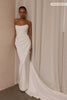 A woman wearing a strapless white wedding gown with a draped bodice and floor-length silhouette_xs_