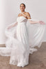 Woman wearing a lace wedding dress with sheer sleeves_L_