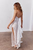 Woman wearing a lace wedding dress with a high split_XS_