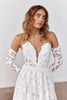 Woman wearing a strapless lace wedding dress with long sleeves_XS_