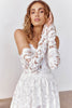 Woman wearing a lace wedding dress and gloves_XS_