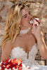 Woman in a wedding dress eating cake_XS_