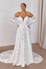 Woman wearing a lace wedding dress with long sleeves_L_