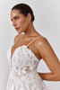 Woman wearing a lace wedding dress with straps_L_