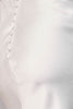 Close-up of Emory's satin fabric