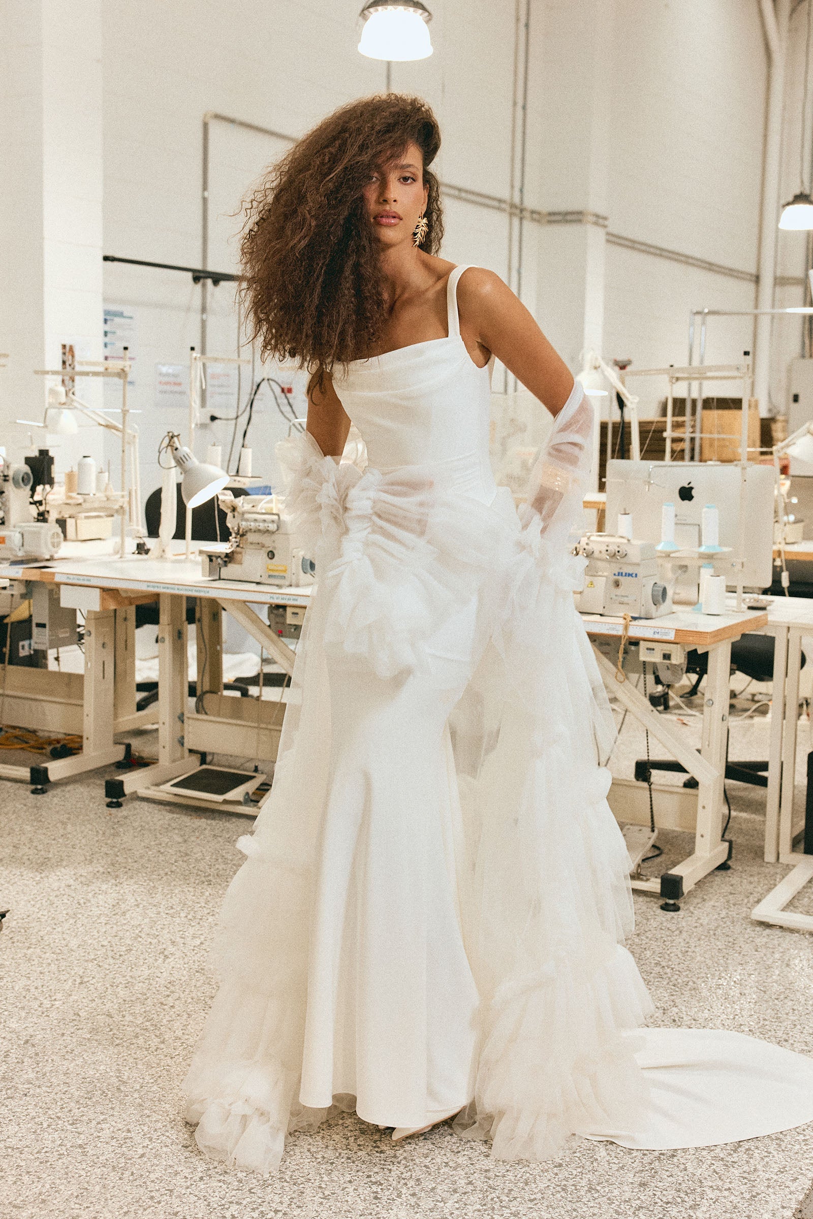 Woman in a design house wearing a wedding dress_XS_