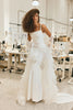 Woman in a design house wearing a wedding dress_XS_