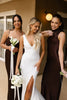 Woman in a wedding dress with two women in brown bridesmaid dresses