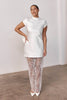 Woman wearing a short wedding dress and sheer skirt_L_