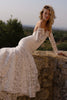 A woman on a ledge in a strapless lace wedding dress_XS_