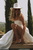 Woman in a strapless wedding dress and hat_XS_