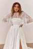 Woman wearing a satin wedding dress with a sheer bridal cape_XS_