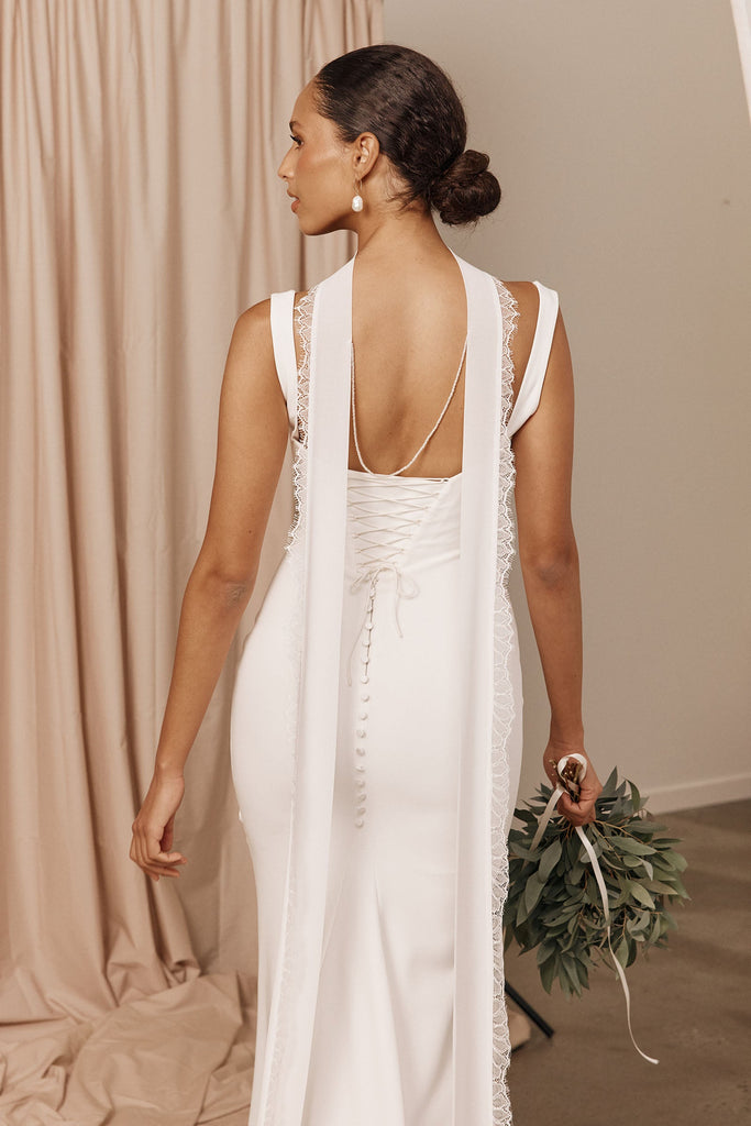 Model wearing a bridal neckscarf and wedding dress