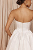 Back detailing of a strapless satin wedding dress