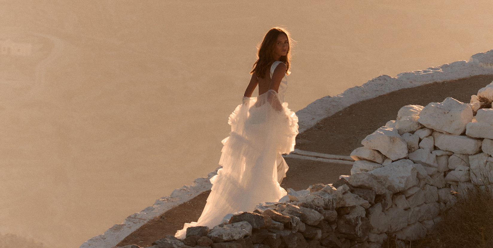 backless wedding dress paired with bridal robe