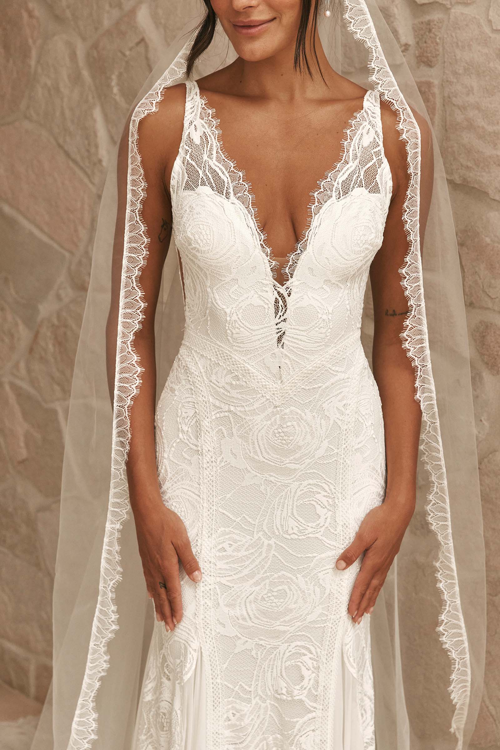 With exquisite lace detailing, a flattering V neckline, and a chic