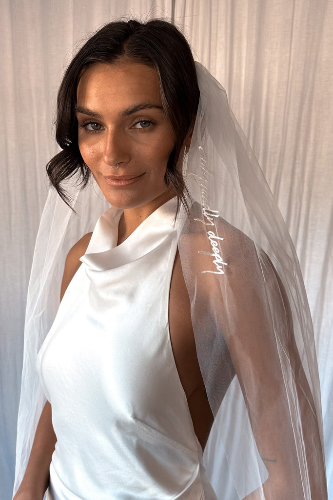 Model wearing the Goldie Gown paired with the Truly Madly Deeply Short Veil