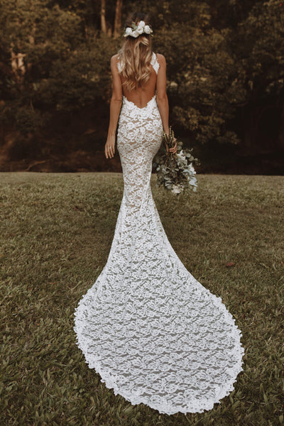 Elegant white gown with water-inspired design on Craiyon