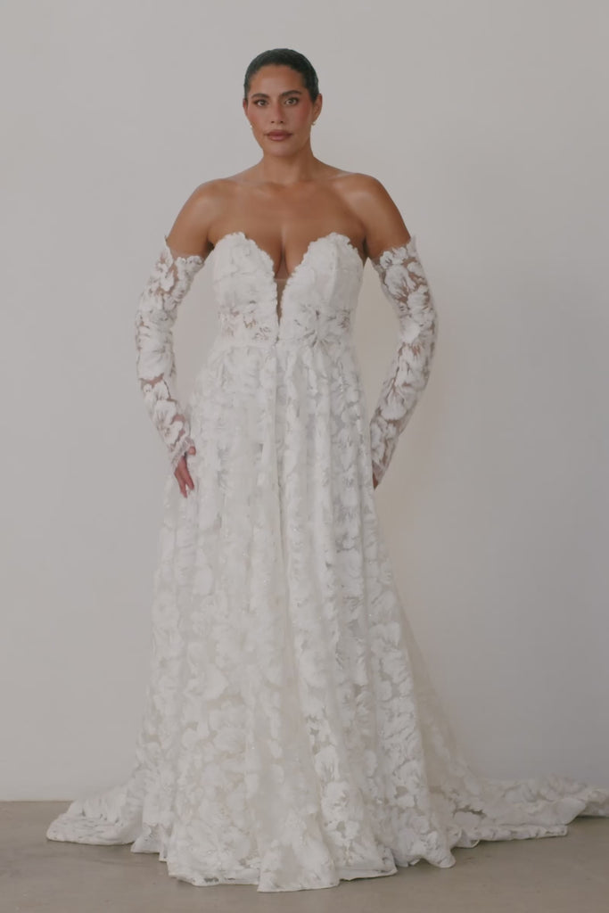 Video of a strapless lace wedding dress