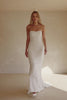 Video of a woman wearing a strapless white mermaid-style gown