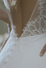 A woman in a lace wedding dress.