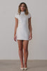 A short wedding dress with an open back and bow detail.