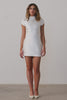 A short wedding dress with an open back and bow detail.