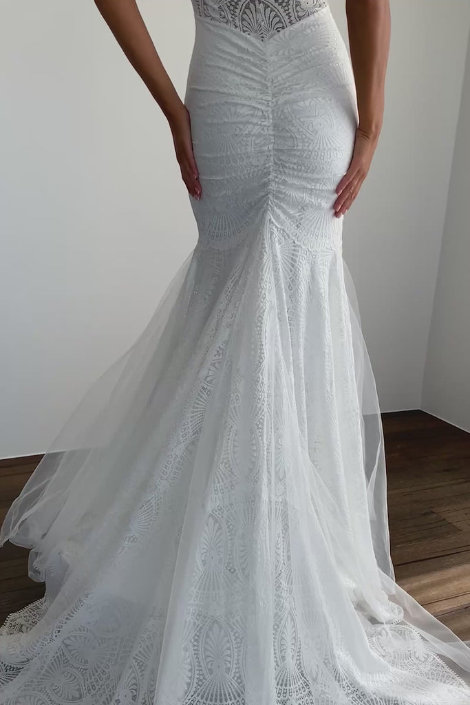 Woman wearing a lace wedding dress.