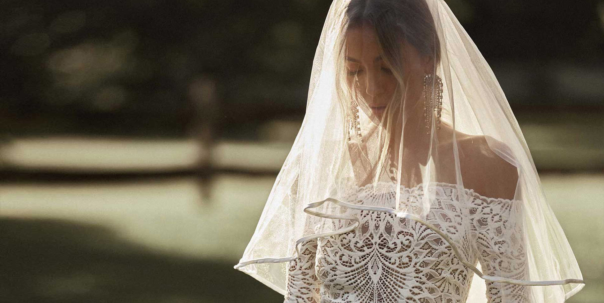 Woman wearing a blusher veil and wedding dress